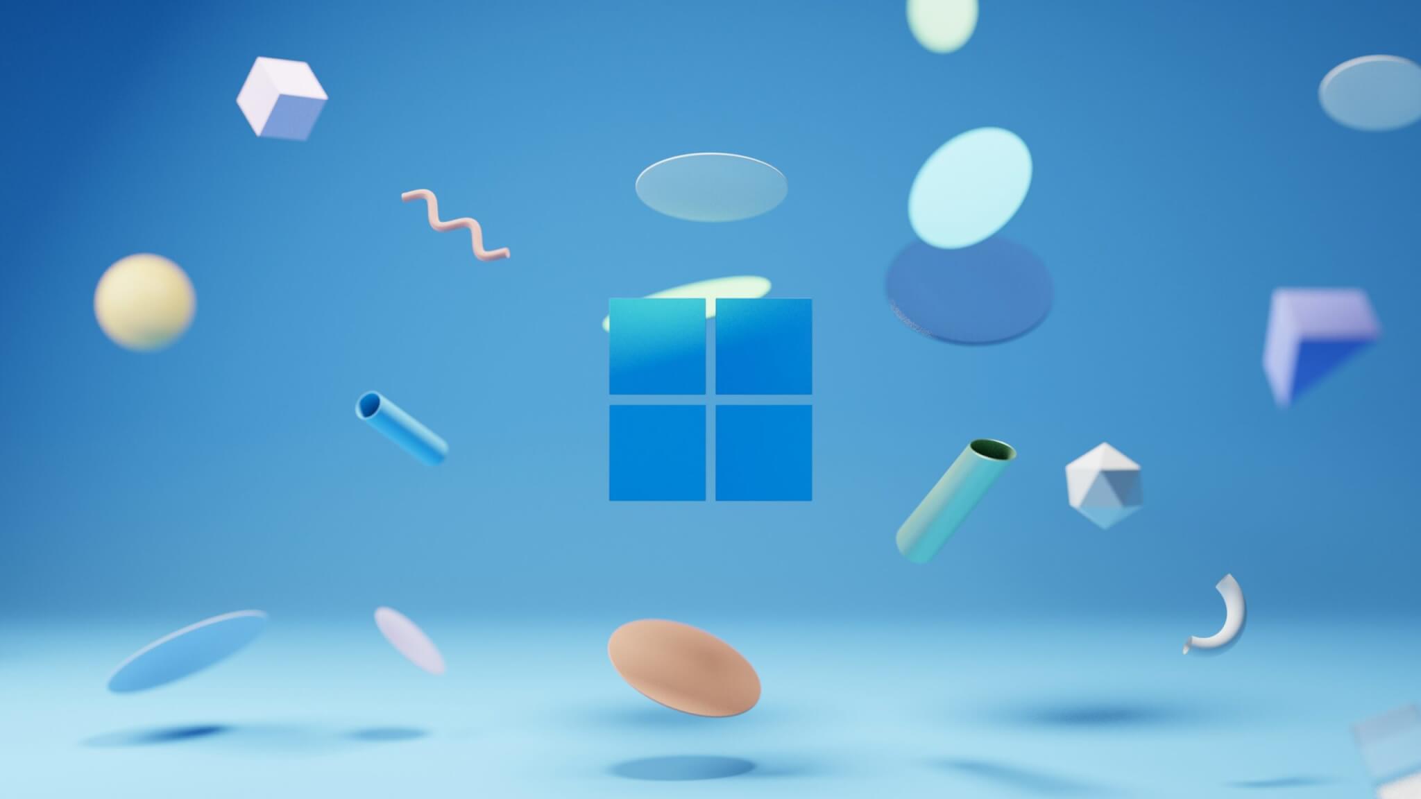 A blue banner with the Microsoft logo in the middle. Various floating abstract objects surround the logo.
